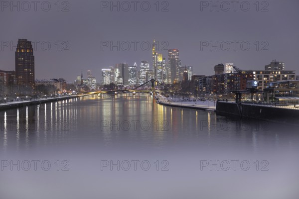 There is snow on the banks of the Main from the Wesel shipyard to the Frankfurt banking skyline, Osthafen, Frankfurt am Main, Hesse, Germany