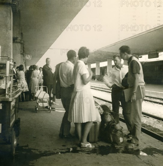 Historical photo summer 1961, tourists in front of returning home at Rimini train station, Rimini, Italy