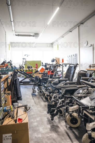 Spacious workshop with wheelchairs and rehabilitation equipment, clean and modern, medical supply store