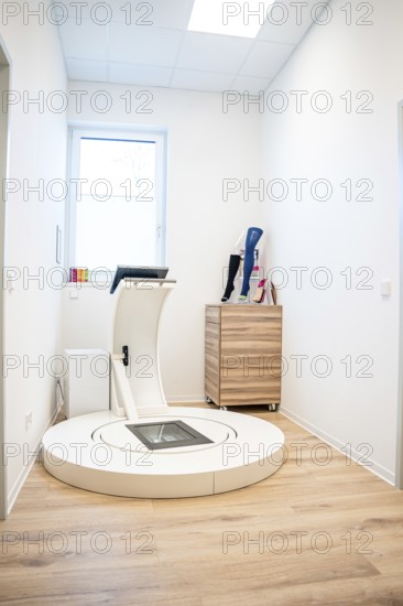 Modern room with scanning device for orthopedic prosthetics, minimalistically furnished, medical supply store