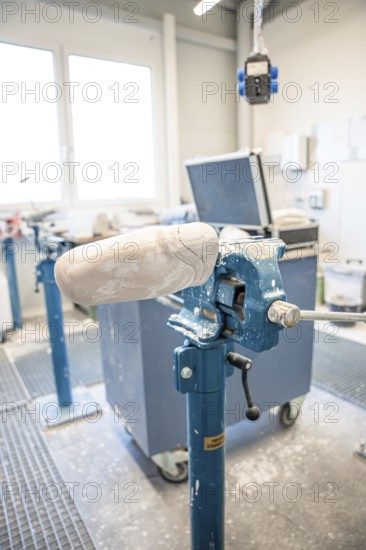 Workbench with plaster model for prosthesis production in a bright environment, medical supply store