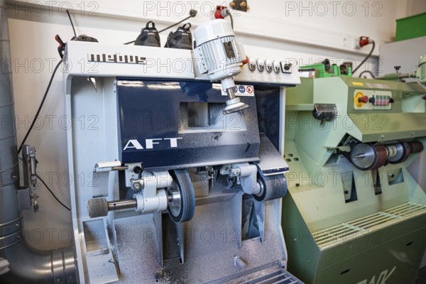 Industrial grinding machine in a metalworking workshop, medical supply store
