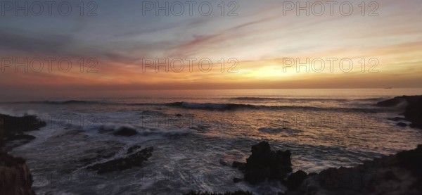 Sunset on the fishing trail over the sea with calm waves and colorful skies, Southwest Alentejo nature park Park, Vicentina Coast, Portugal