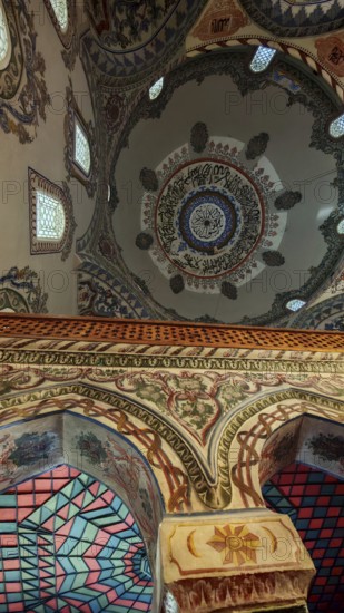 Richly decorated dome interior view with floral and geometric patterns in vivid colors, Prizren, Kosovo