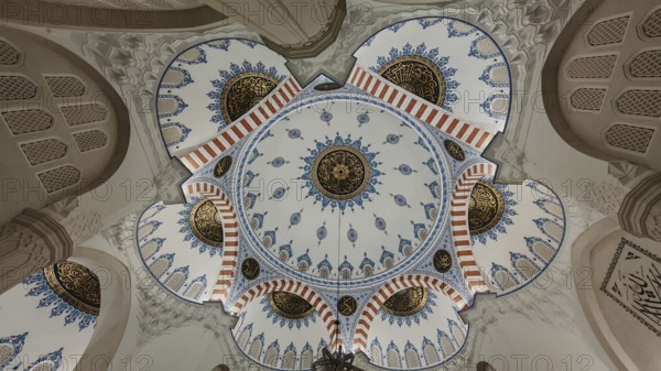 Detailed view of a richly decorated dome with blue and gold ornaments in Islamic architecture, Tirana, Albania