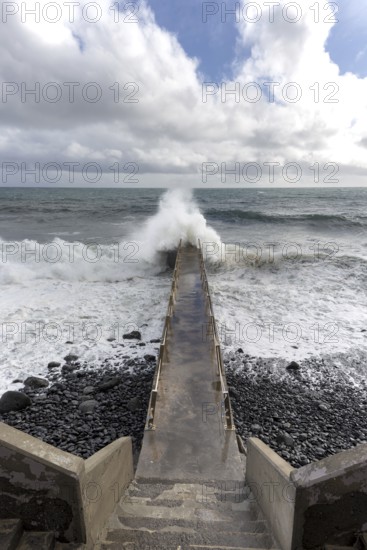 Pier during storm, bridge with waves, Atlantic Ocean, Madeira, Portugal