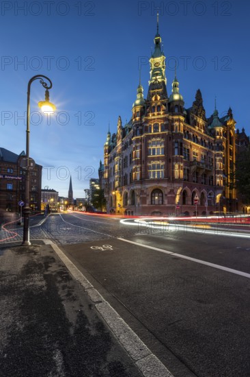 Speicherstadtrathaus in Speicherstadt with road traffic at the blue hour, Hamburg, Germany