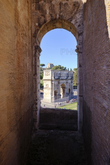View through round arch of Constantine's Arch from the Colosseum, Rome, Lazio, Italy