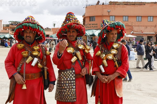 Traditional water sellers on Djemaa el Fna, Hanged Square, Gauklerplatz, Marrakech, historic old town, Medina, UNESCO World Heritage Site, Morocco