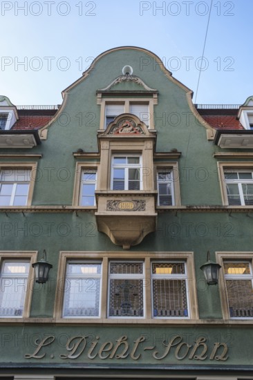 Historic building façade from the Wilhelminian period with green paint and decorative details, Singen am Hohentwiel, Hegau, Konstanz district, Baden-Württemberg, Germany