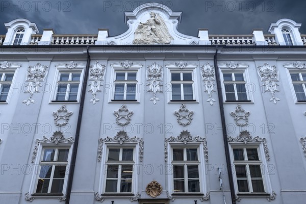Historic house façade, a relief of Saint Florian on the gable, Krakow, Poland