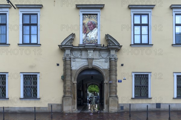 Mosaic portrait of Pope John Paul II above an entrance portal, Krakow, Poland