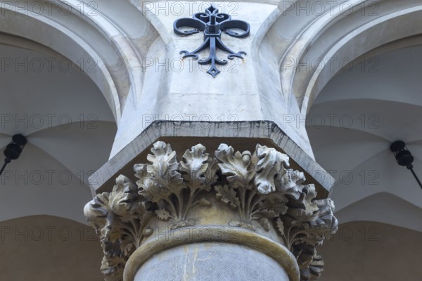 Relief of arcant leaves on the pillars of the arcades of the Cloth Hall, Krakow, Poland