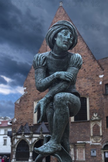 Fountain by Jan Budzillo, figure of a student, copy of a figure from the Marian Altar, Main Market Square, Krakow, Poland