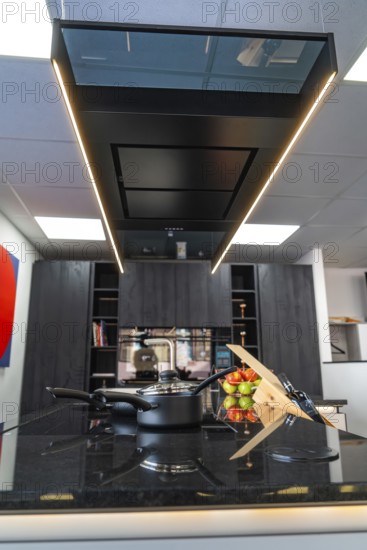Elegant kitchen with black work surface and stylish decor