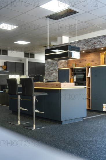 Detail of a modern kitchen with brick wall and stylish lighting