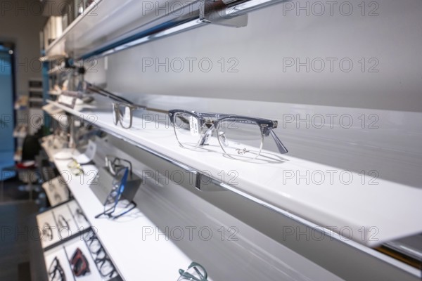 Elegant eyeglass shelf with clear glasses in a modern showroom, optician, Pforzheim