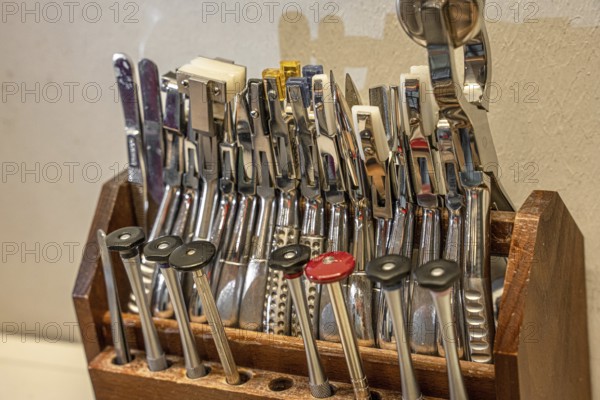 Various optical tools neatly arranged in a wooden holder, optician, Pforzheim