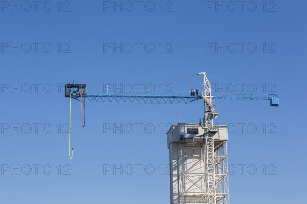 Montreal Bungee Tower with dangling long yellow elastic bungee jumping cord, Old Port of Montreal, Quebec, Canada