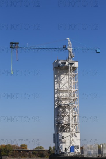 Montreal Bungee Tower with dangling long yellow elastic bungee jumping cord, Old Port of Montreal, Quebec, Canada
