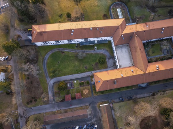 Building complex with red roof and green spaces, visible from aerial view, Rehab Clinic, Schömberg, Black Forest, Germany