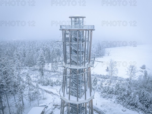 An observation tower in winter fog over a snowy environment, Himmelsglück observation tower with Flying Fox, Schömberg, Black Forest, Germany