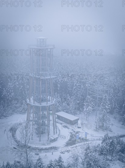 A foggy, snow-covered treetop trail rises in the winter landscape, Himmelsglück observation tower with Flying Fox, Schömberg, Black Forest, Germany