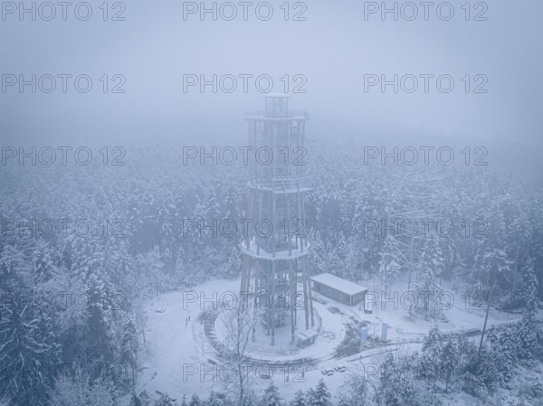 A treetop trail in a foggy, snowy winter landscape from above, Himmelsglück observation tower with Flying Fox, Schömberg, Black Forest, Germany
