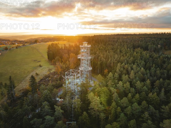 Tower immersed in the warm light of the dawning day, Himmelsglück observation tower with Flying Fox, Schömberg, Black Forest, Germany
