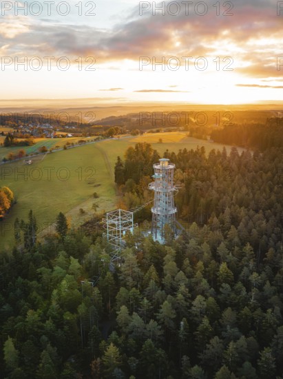 Tower surrounded by forests and meadows at sunset, Himmelsglück observation tower with Flying Fox, Schömberg, Black Forest, Germany