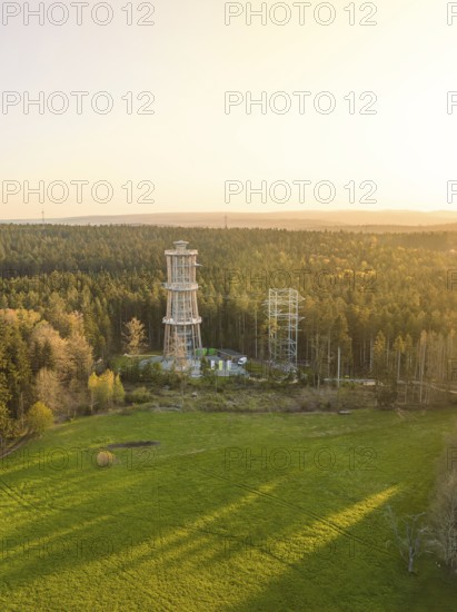 Tower in open area with forests at sunset, sky in evening light, observation tower Himmelsglück with Flying Fox, Schömberg, Black Forest, Germany