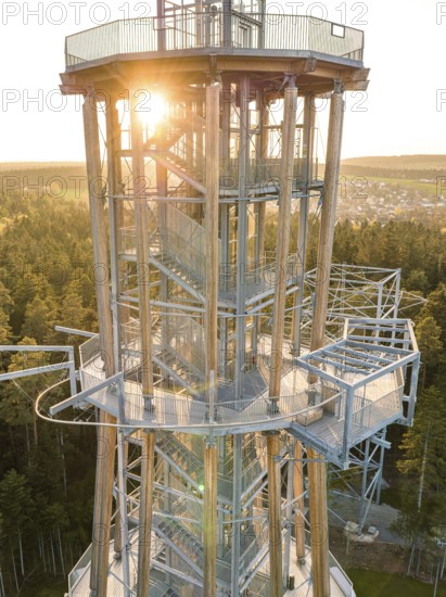 Tower in evening light, sun rays breaking through the metal structure, Himmelsglück observation tower with Flying Fox, Schömberg, Black Forest, Germany