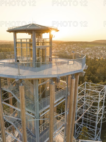 Observation tower with a view of a city in the background at sunset, Himmelsglück observation tower with Flying Fox, Schömberg, Black Forest, Germany