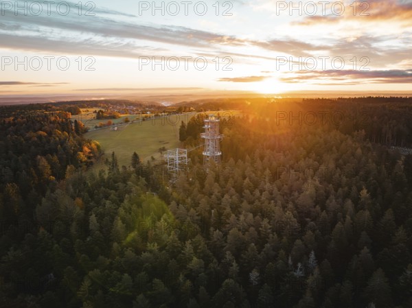 Sunset behind an observation tower in the middle of a vast forest, Himmelsglück observation tower with Flying Fox, Schömberg, Black Forest, Germany