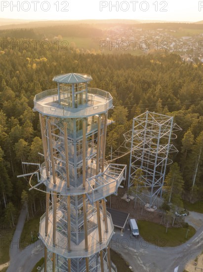 A modern observation tower in a sunny forest offers a view of the city, Himmelsglück observation tower with Flying Fox, Schömberg, Black Forest, Germany