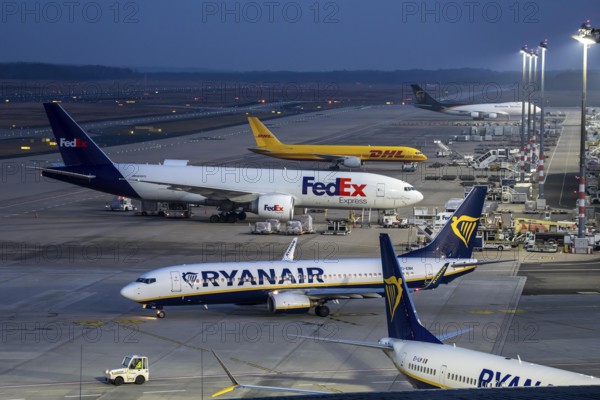 Air freight center, FedEx Boeing 777-FS2, DHL aircraft, UPS Boeing 747, jumbo jet, cargo aircraft, Ryanair Boeing 737 on the way to takeoff, at Cologne/Bonn airport, aircraft at the terminal, North Rhine-Westphalia, Germany