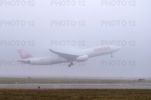 Swiss aircraft, HB-JHG, Airbus A330-300, departure in fog, Zürich Kloten, Switzerland