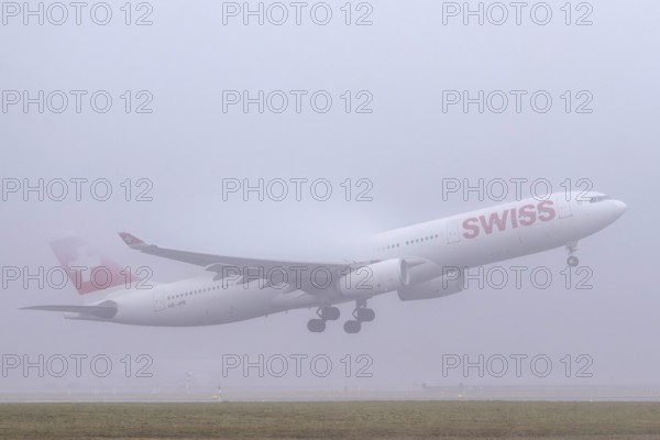 Swiss aircraft, HB-JHE Airbus A330-300, departure in fog, Zürich Kloten, Switzerland