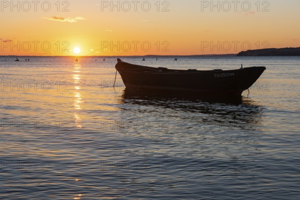 Sunset with boat on the lagoon near Gager on Rügen, Rügen, Gager, Mecklenburg-Western Pomerania, Germany
