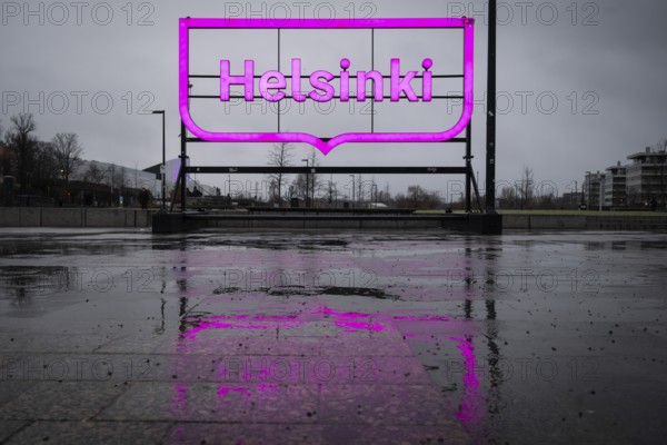 Large pink city logo of Helsinki near Oodi Central Library and Cultural Center, Helsinki, Finland