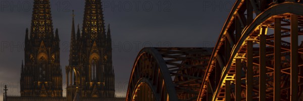 Evening atmosphere, Cologne Cathedral illuminated with LED lamps and the Hohenzollern Bridge, Cologne, North Rhine-Westphalia, Germany
