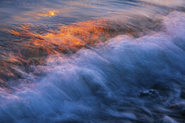 Wave play at sunrise on the chalk coast in Jasmund National Park, Rügen, Sassnitz, Mecklenburg-Western Pomerania, Germany