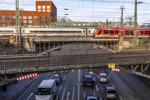 ICE and S-Bahn train on the line, railway bridge over Deutz-Mülheimer-Straße, more than 10 tracks crosses the road on 6 bridge structures, platform tracks in front of Cologne-Messe/Deutz station, North Rhine-Westphalia, Germany