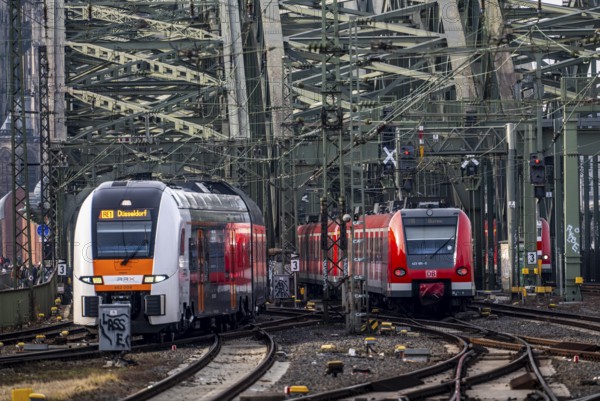 Rail system in front of Cologne Central Station, Hohenzollern Bridge across the Rhine, RRX, Rhine-Ruhr Express, regional train, regional trains, in front of the railway bridge, Cologne, North Rhine-Westphalia, Germany