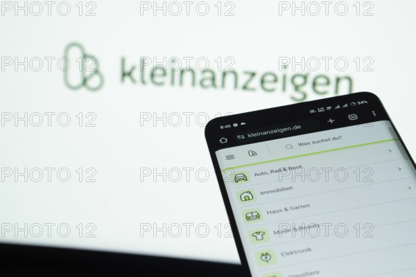 Dhaka, Bangladesh- 03 July 2025: Smartphone displaying Kleinanzeigen web interface against Kleinanzeigen logo background