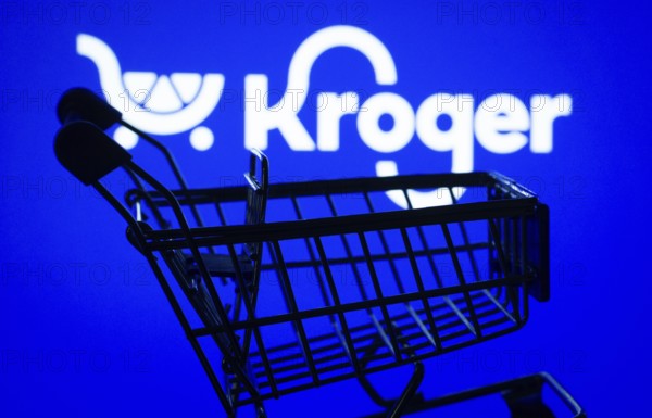 Dhaka, Bangladesh- 03 July 2025: Silhouette of a shopping cart in front of the Kroger logo, symbolizing ecommerce and online shopping