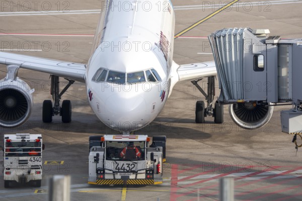 Eurowings Airbus is pushed from the gate onto the taxiway, ready to go, to Cologne/Bonn Airport, CGN, North Rhine-Westphalia, Germany