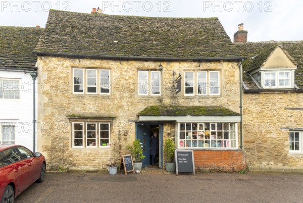 National Trust shop in historic Cotswold stone building, village of Lacock, Wiltshire, England, UK