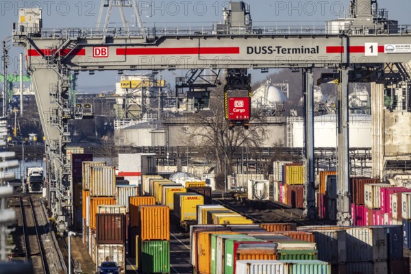 The port of Mannheim is one of the most important inland ports in Europe. The harbor basins stretch across the Rhine and Neckar. DUSS Terminal Deutsche Bahn AG with container from DB Cargo in the Mühlauhafen container terminal. Mannheim, Baden-Württemberg, Germany