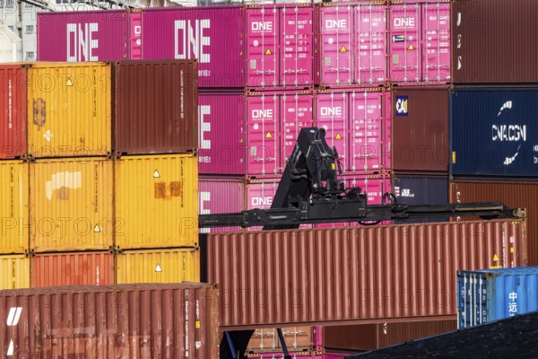 Colourful sea containers in the container port. The port of Mannheim is one of the most important inland ports in Europe. Mannheim, Baden-Württemberg, Germany